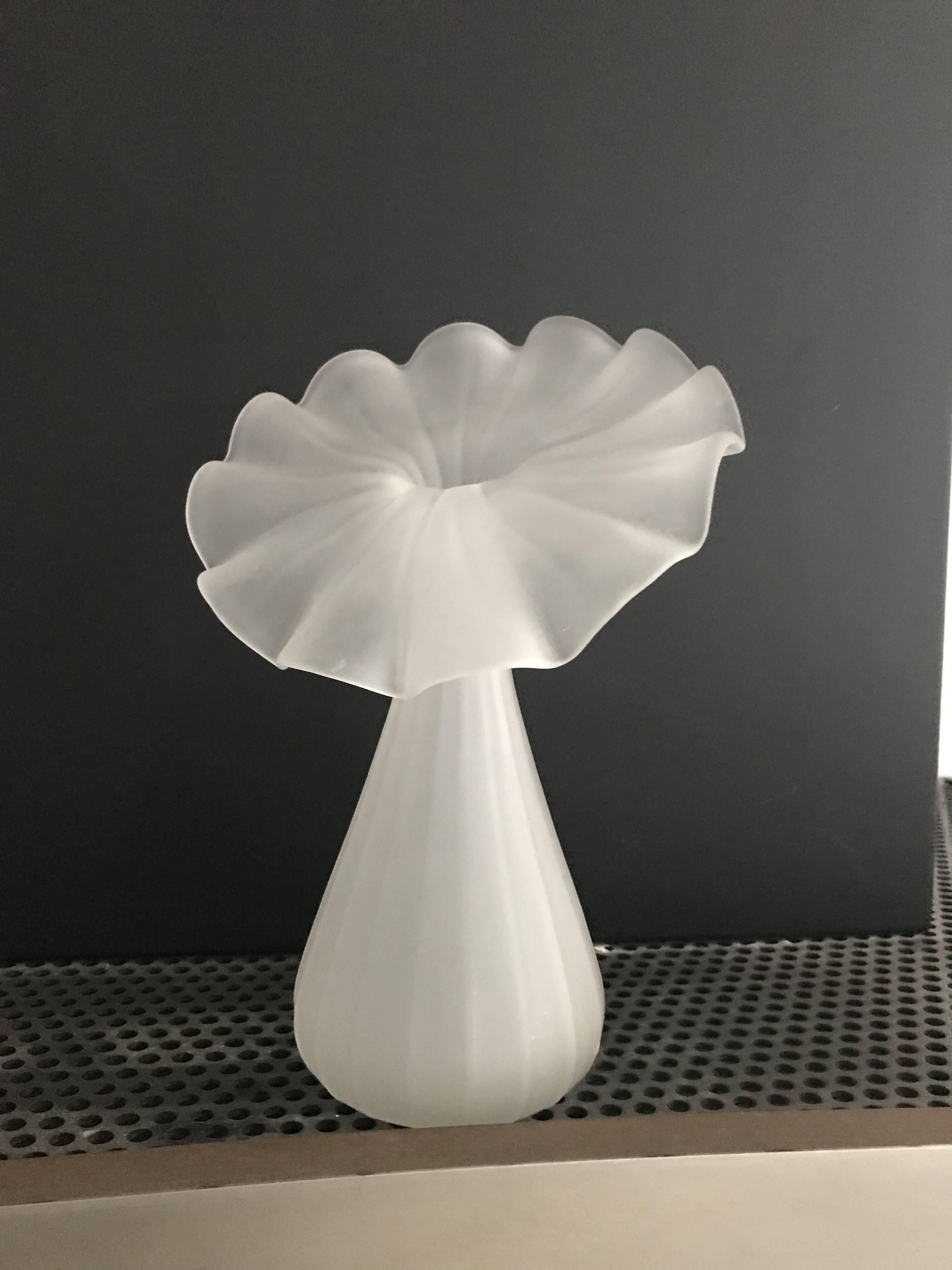 Vintage satin white glass vase with a wavy corolla