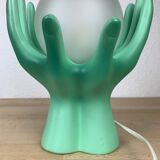 Green ceramic hand lamp and glass globe