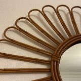 Old vintage asymmetrical round rattan mirror