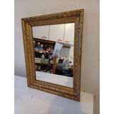 Wooden mirror and gold trim