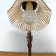 Gold swan neck table lamp with amber tulip glass.