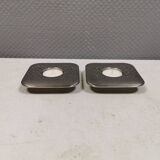 A set of classic Danish candlesticks in polished metal.