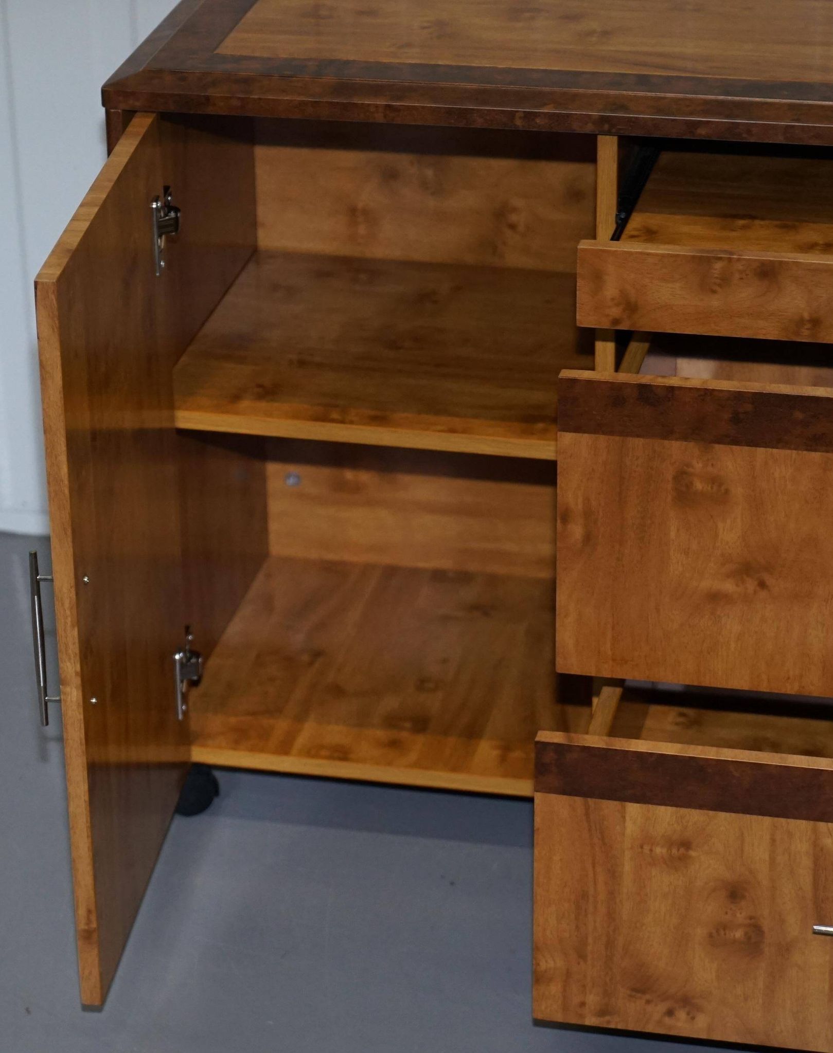 Walnut Burr buffet with drawers and wheels, part of a set.