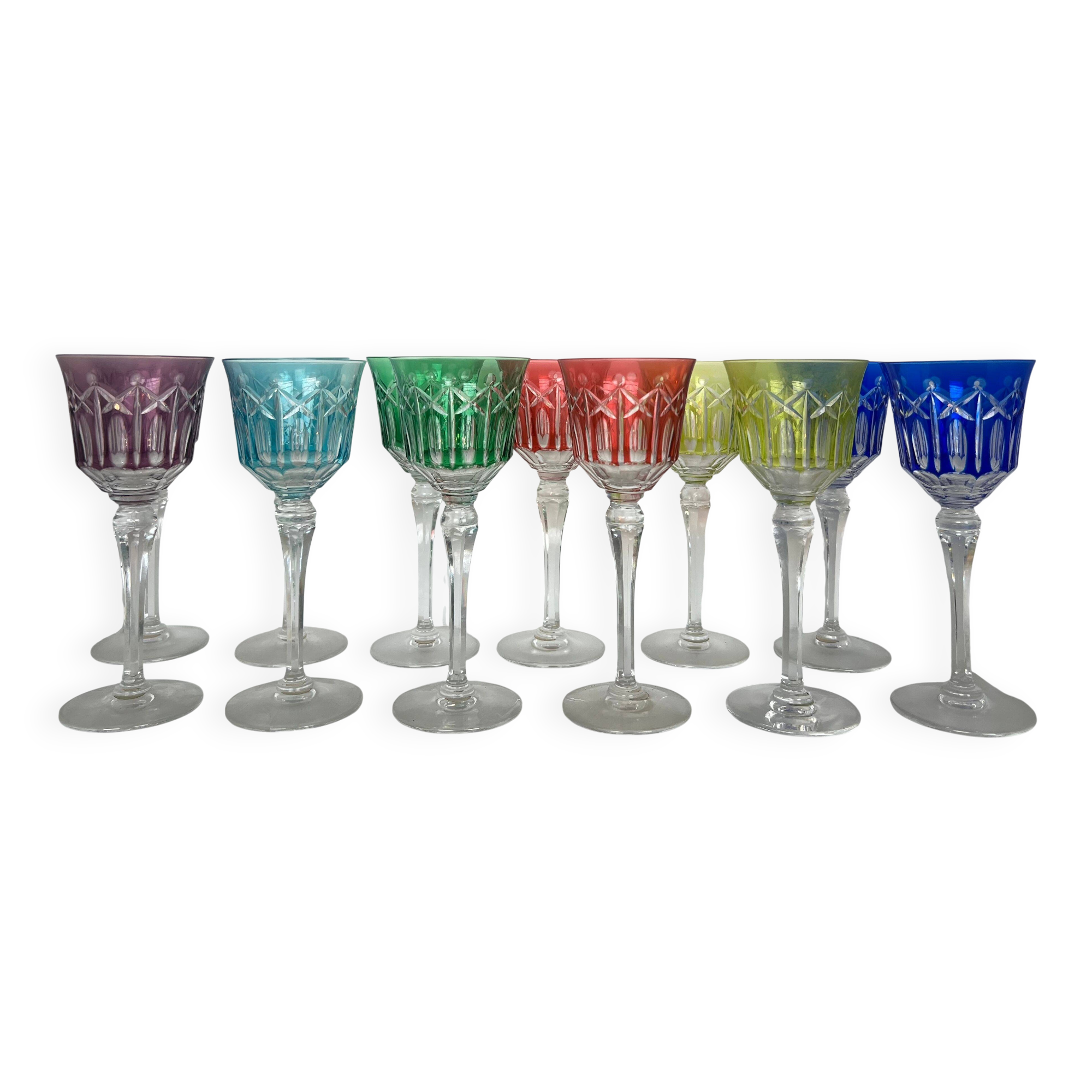 Set of twelve glasses in crystal tinted in different colours and cut with stars.