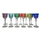 Set of twelve glasses in crystal tinted in different colours and cut with stars.