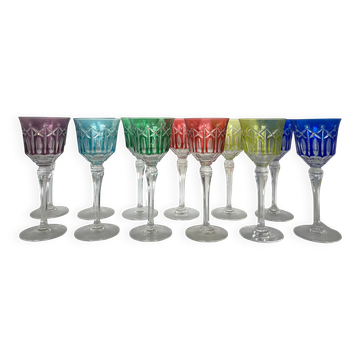 Set of twelve glasses in crystal tinted in different colours and cut with stars.