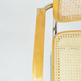 A pair of chairs with armrests, 1970s