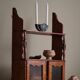 Primitive wall shelf in pine, by a Swedish upholsterer, late 19th century.