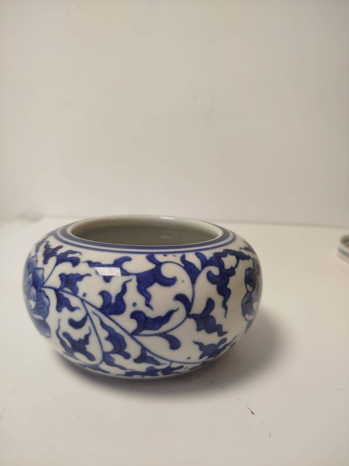 Small round Chinese-style porcelain pot with blue and white decoration