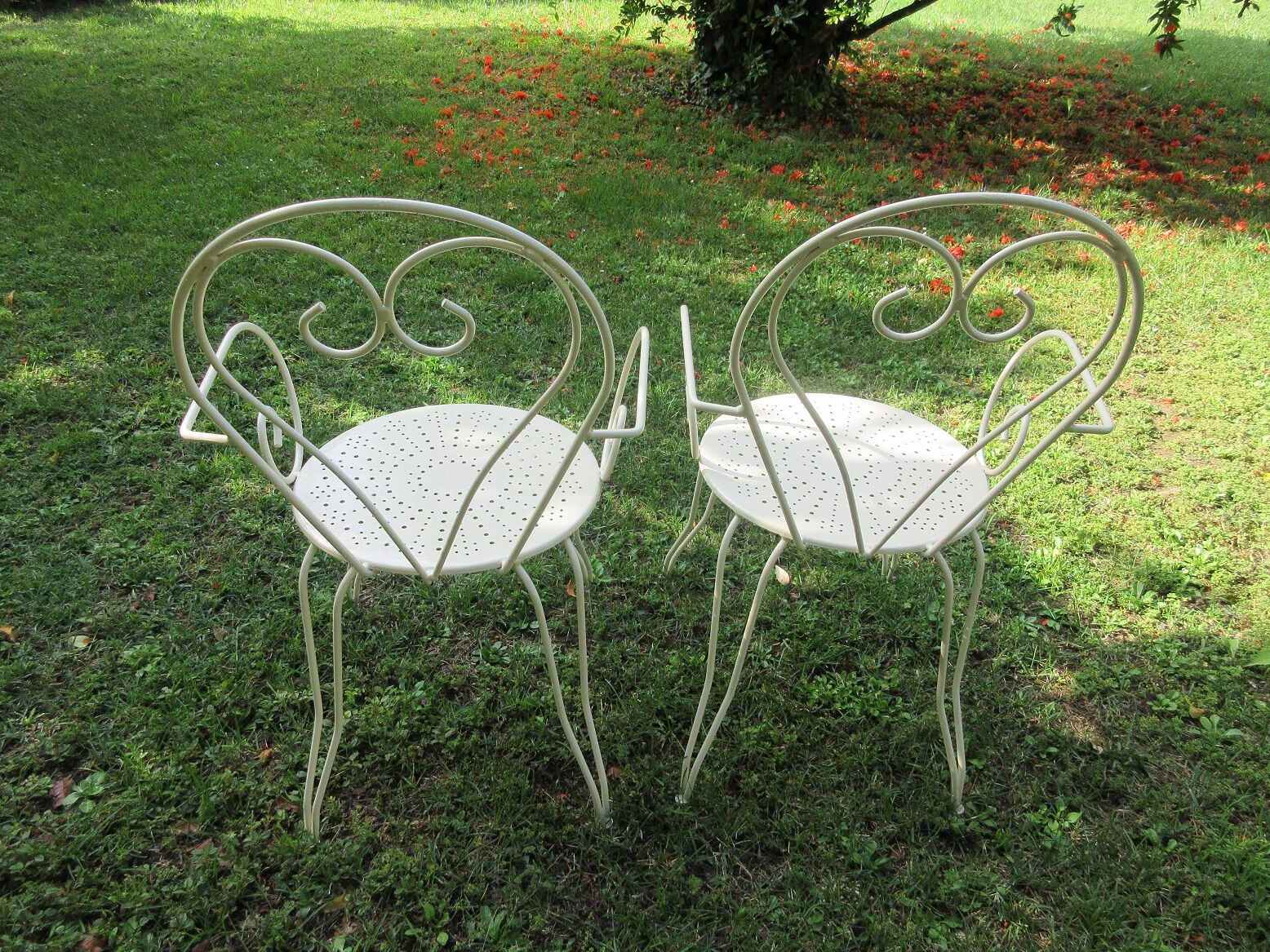 Pair of wrought iron armchairs