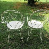 Pair of wrought iron armchairs