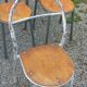 Set of 7 metal chairs by René Herbst with wooden seats.