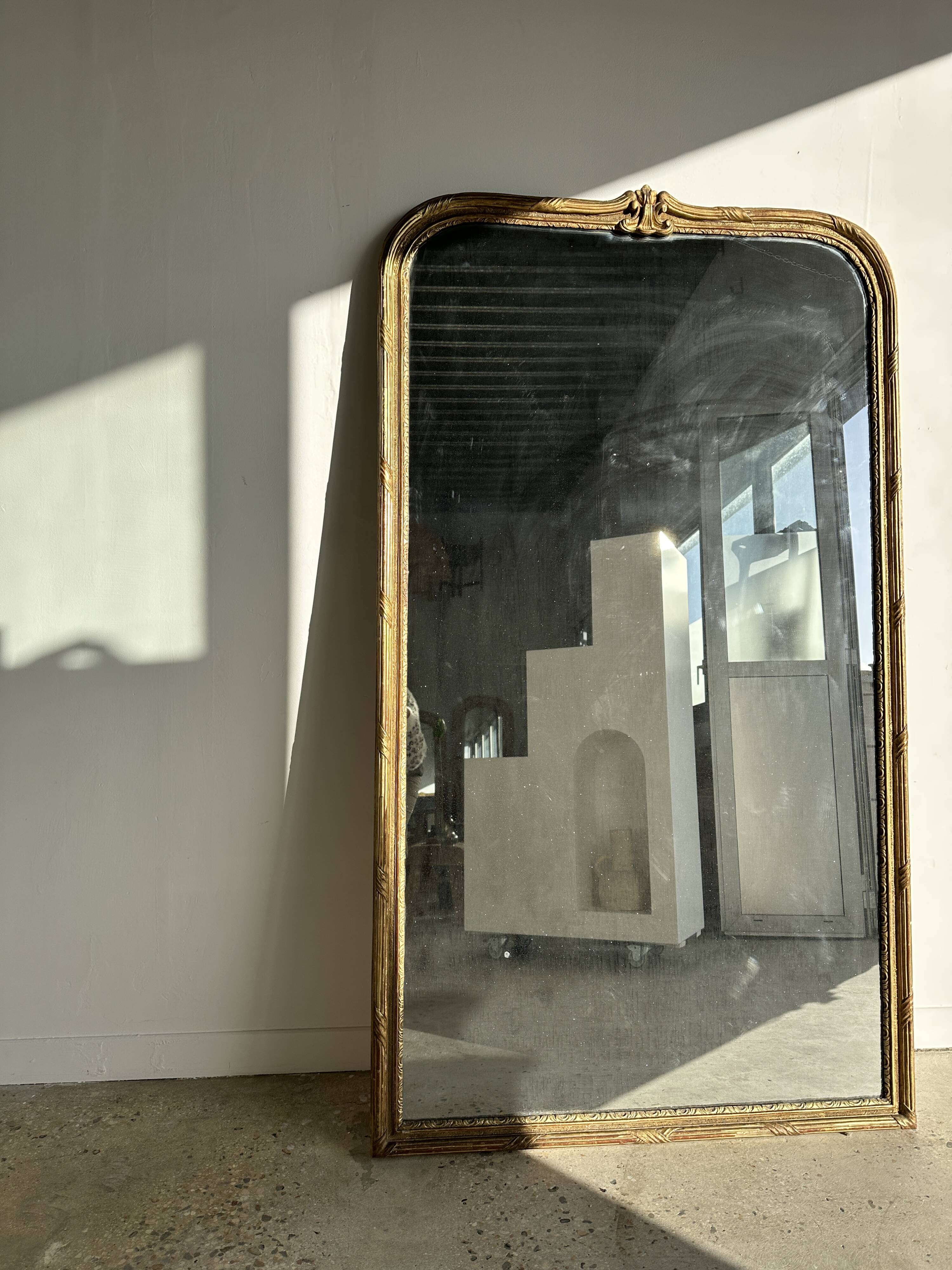 Large gilded mirror 19th century rounded corners mercury glass Louis XVI style