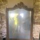 Large antique mirror in wood and gilded stucco.