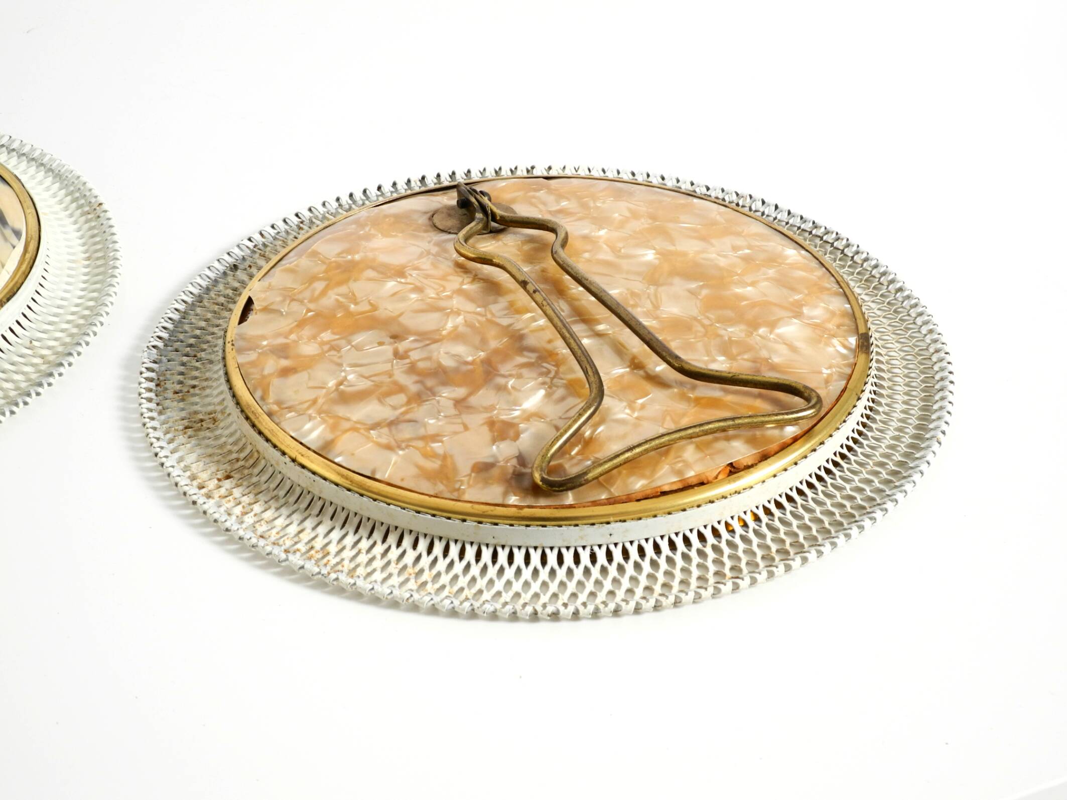 Pair of rare small Mid Century Modern table mirrors with expanded metal fra