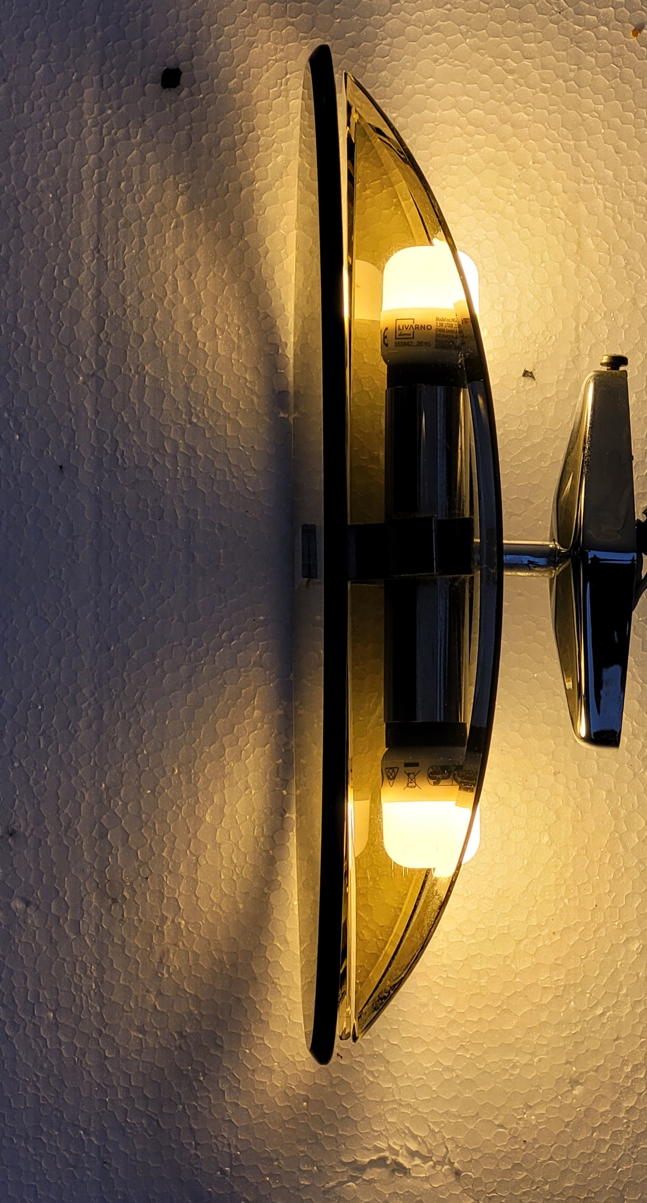 Pair of elliptical italian wall lamps in smoked glass and chrome veca