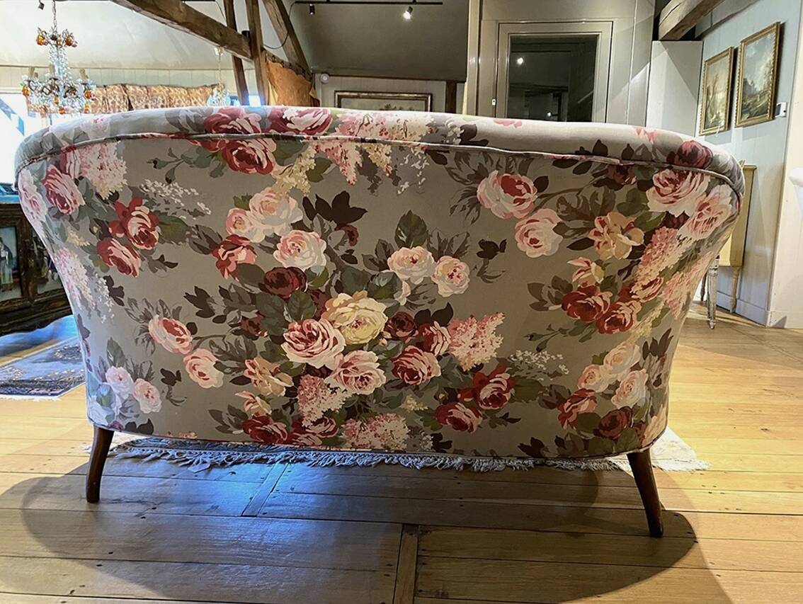 Napoleon III sofa upholstered in a floral patterned fabric