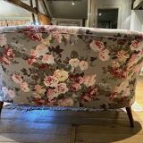Napoleon III sofa upholstered in a floral patterned fabric
