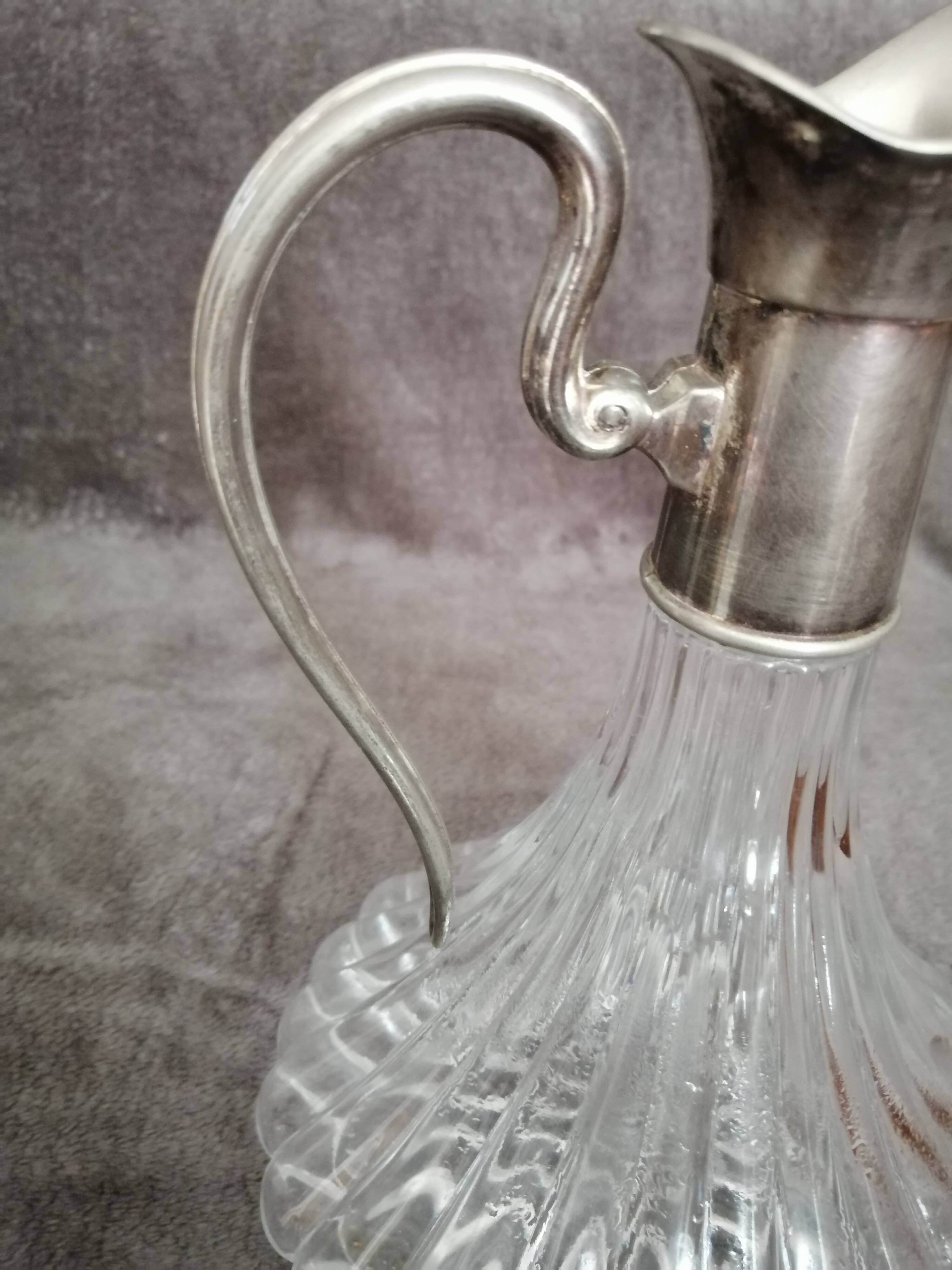 Glass and silver metal wine carafe