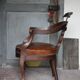 Barber chair in wood and leather with adjustable headrest, office chair.