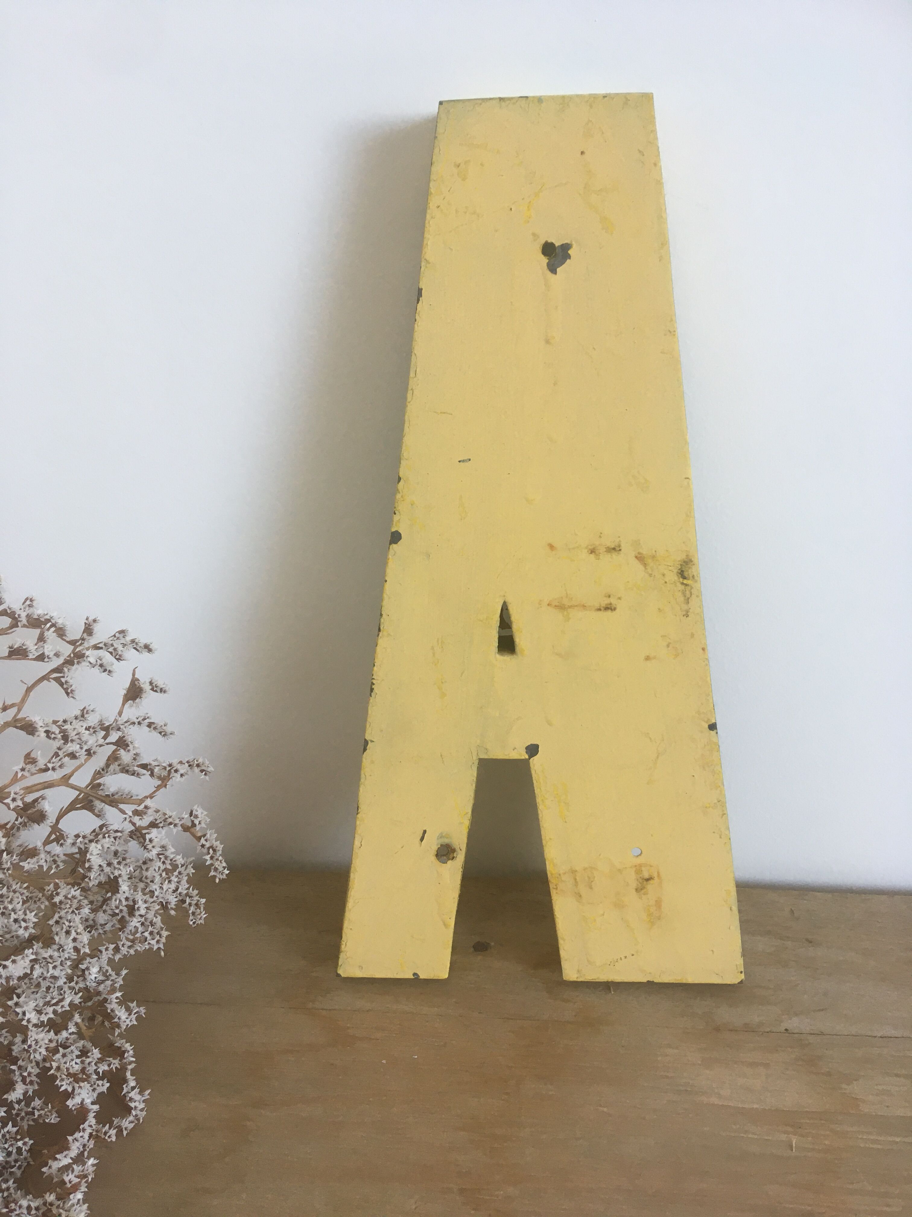 Vintage yellow sign letter A