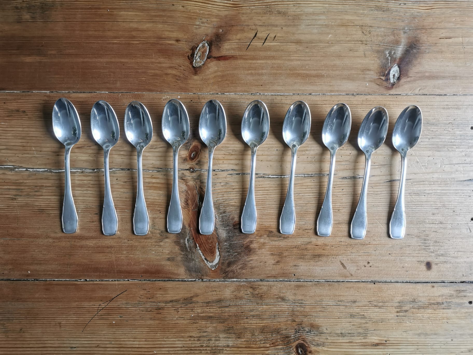 Set of 10 small silver metal spoons