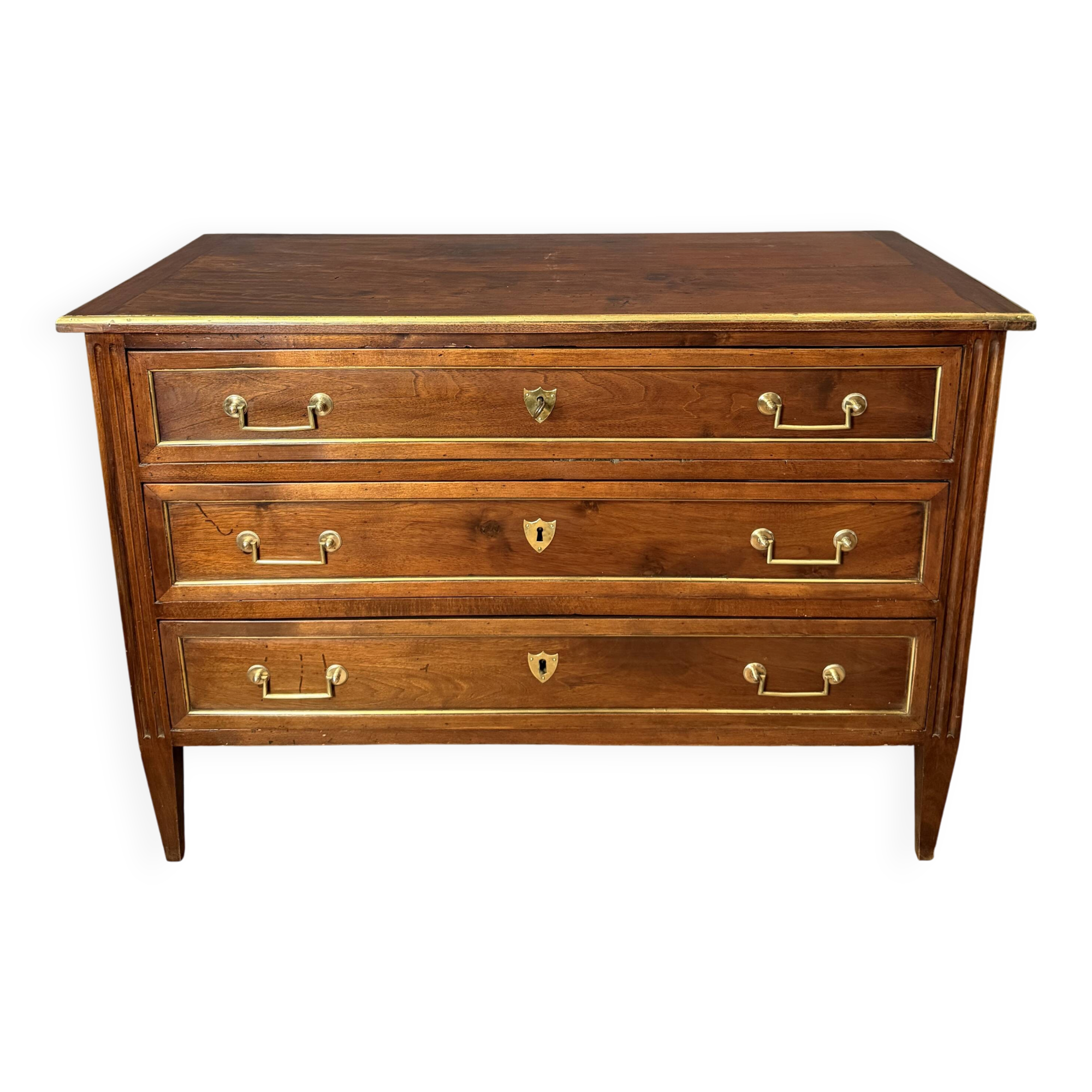 Louis XVI commode in walnut, beech, and brass.