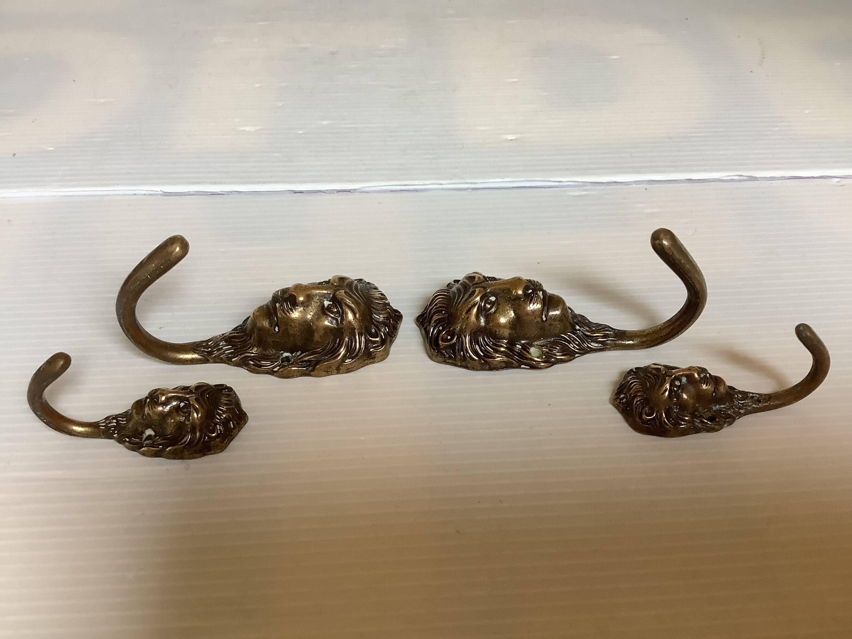 4 lion coat hooks in brass