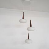 Set of three milk glass and teak pendant lights model NG74 by Louis Kalff for Philips, The Netherlan