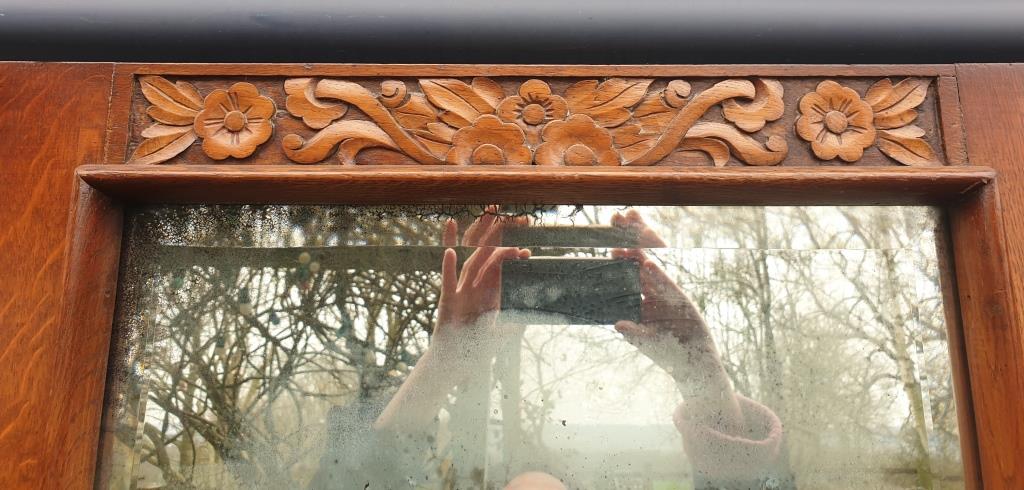 Art Deco door mirror with floral pattern frame