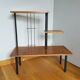 Shelf carries plants on feet modernist style