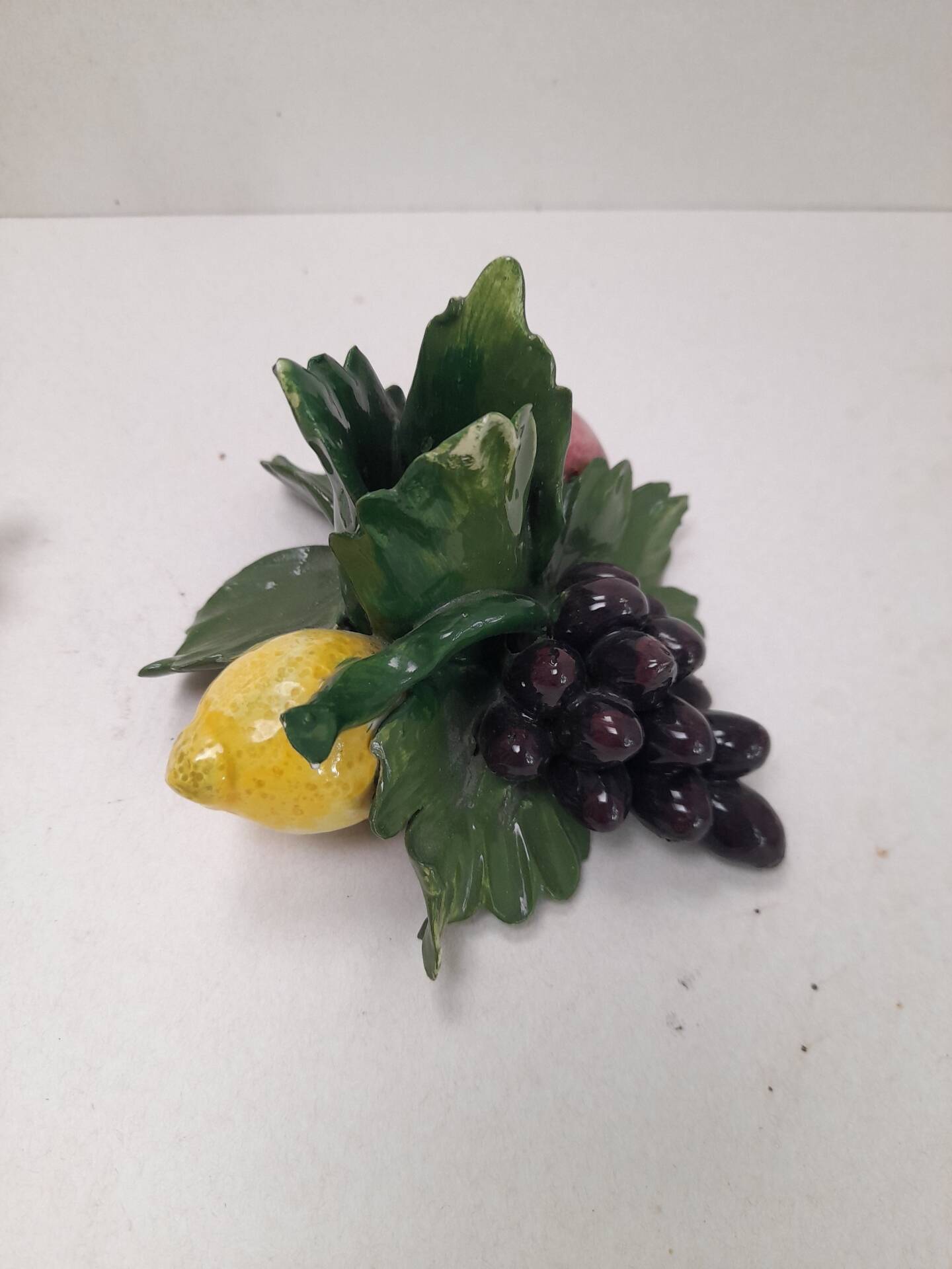 Pair of fruit candle holders in Italian majolica.