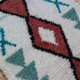 White Boucherouite Moroccan Berber rug with colorful patterns