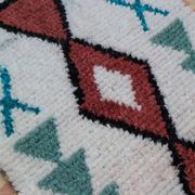 White Moroccan Boucherouite Berber rug with colorful patterns