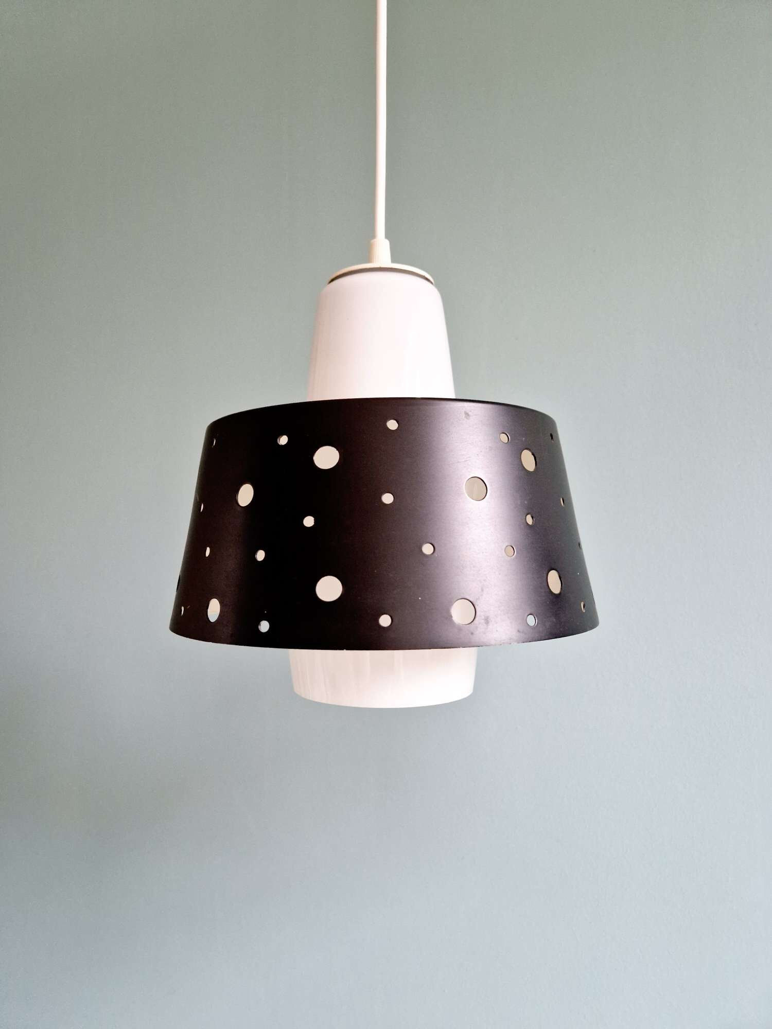 A pair of Scandinavian pendant lights in white opaline and black lacquered metal, 1960.
