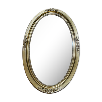 Golden oval mirror