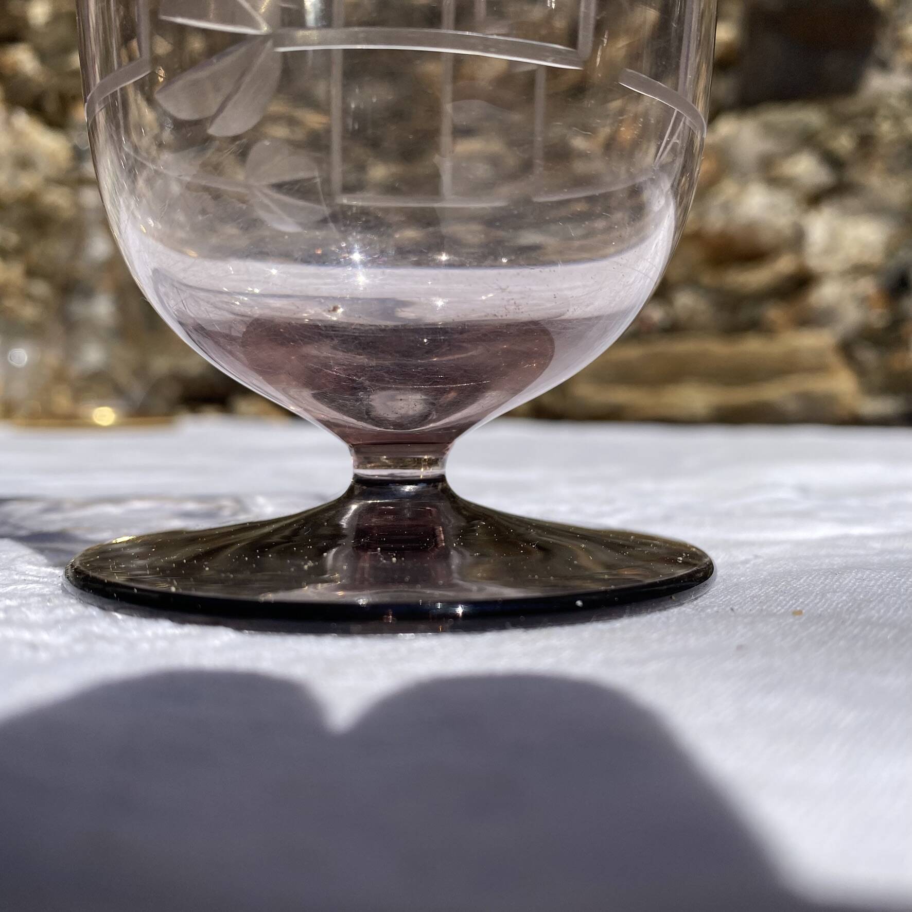 Antique Art Deco engraved glass, silvered rim and base.