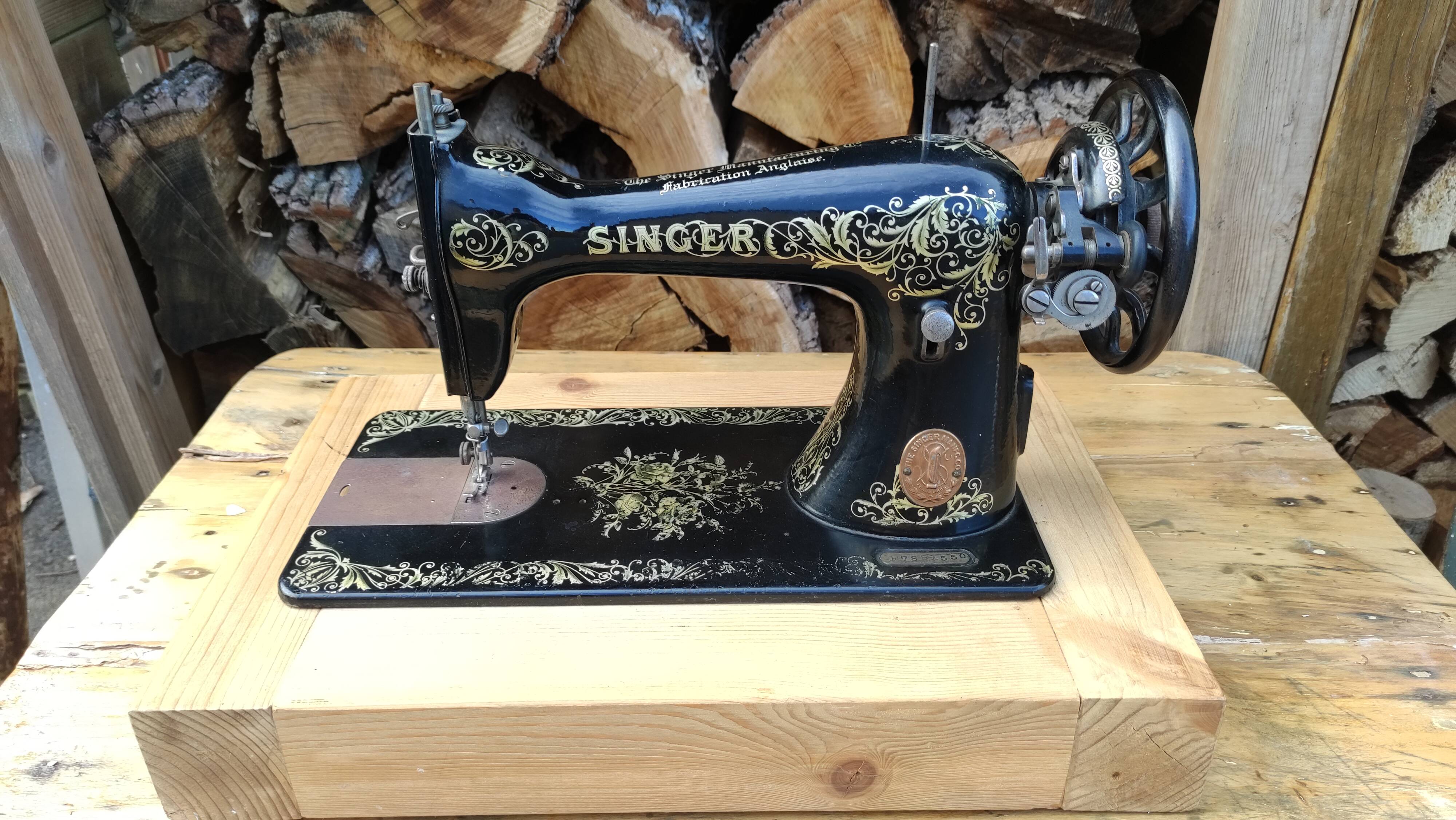 Old Singer sewing machine on pedestal