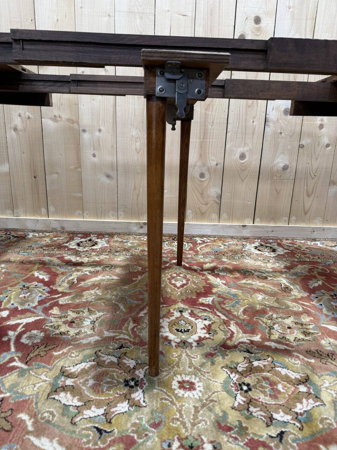 Round dining table with leather top in Louis XVI style.