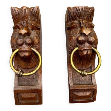 Pair of consoles, corbels, wooden and brass lion supports, 19th century.