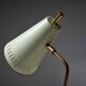 Adjustable table lamp in patinated brass and green metal