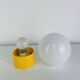 Space Age ball lamp, opaline with a yellow base, 1960s.