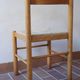 4 solid pine chairs, straw seats, shaped backrest.