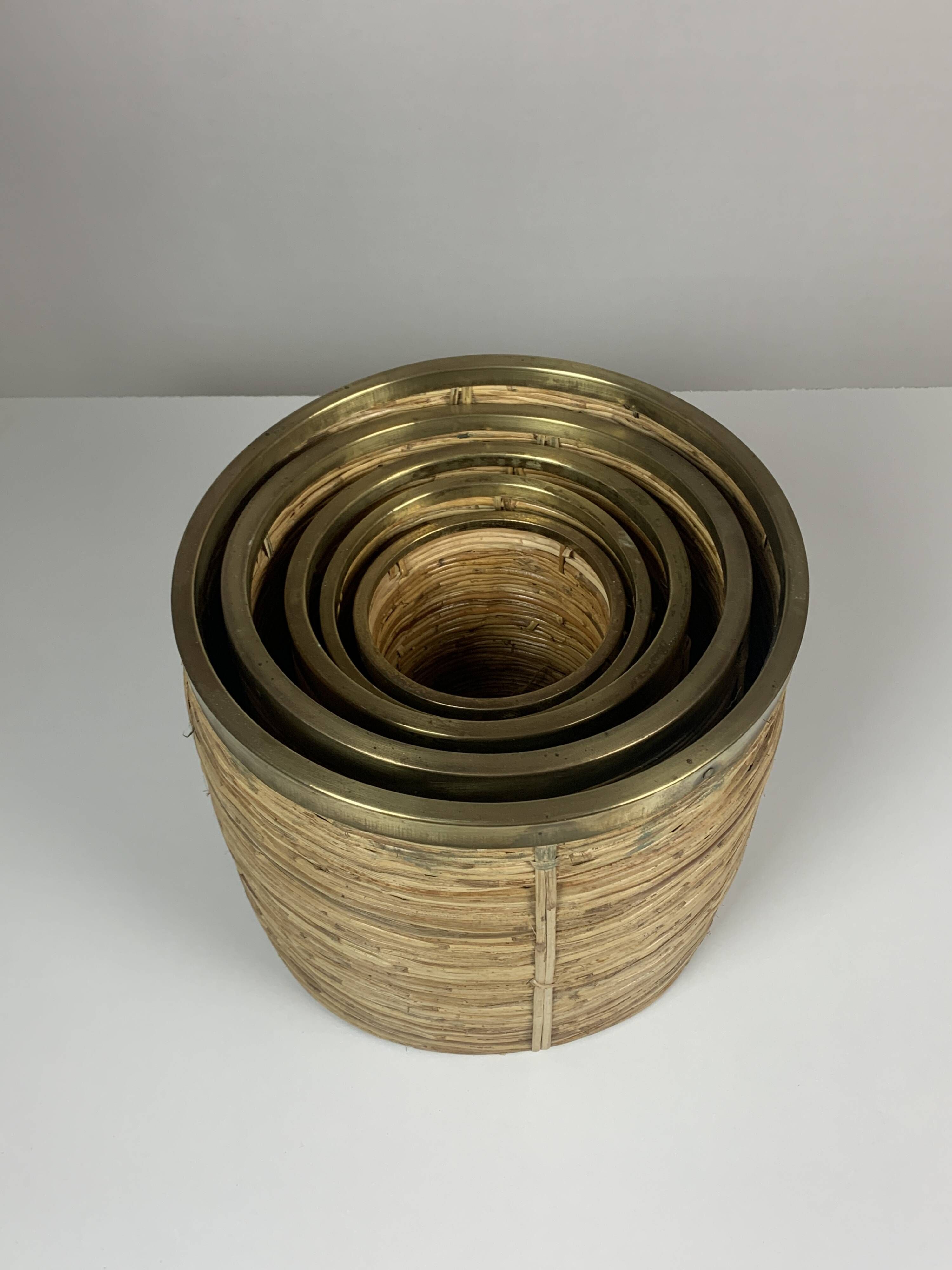 Set of 5 rattan pencil reed and brass plant holder baskets, Italy 1970s