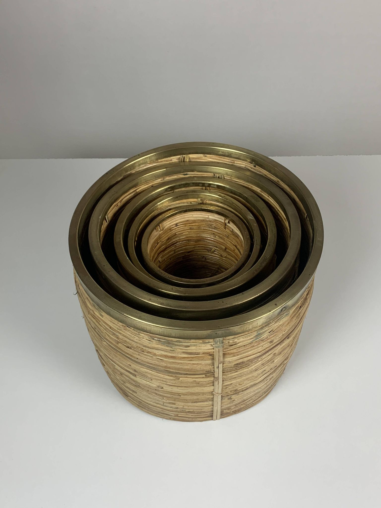 Set of 5 rattan pencil reed and brass plant holder baskets, Italy 1970s
