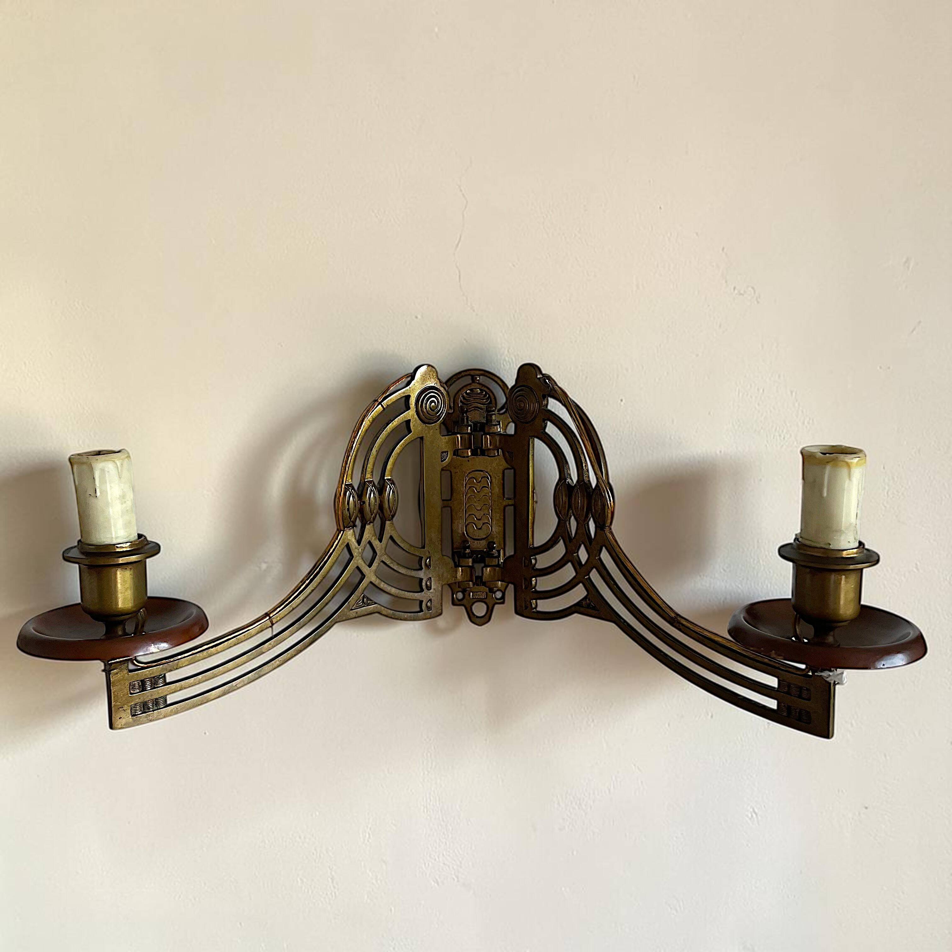 Art Nouveau style brass double piano wall lamp