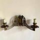 Art Nouveau style brass double piano wall lamp
