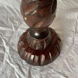 Old ashtray on carved wooden stand