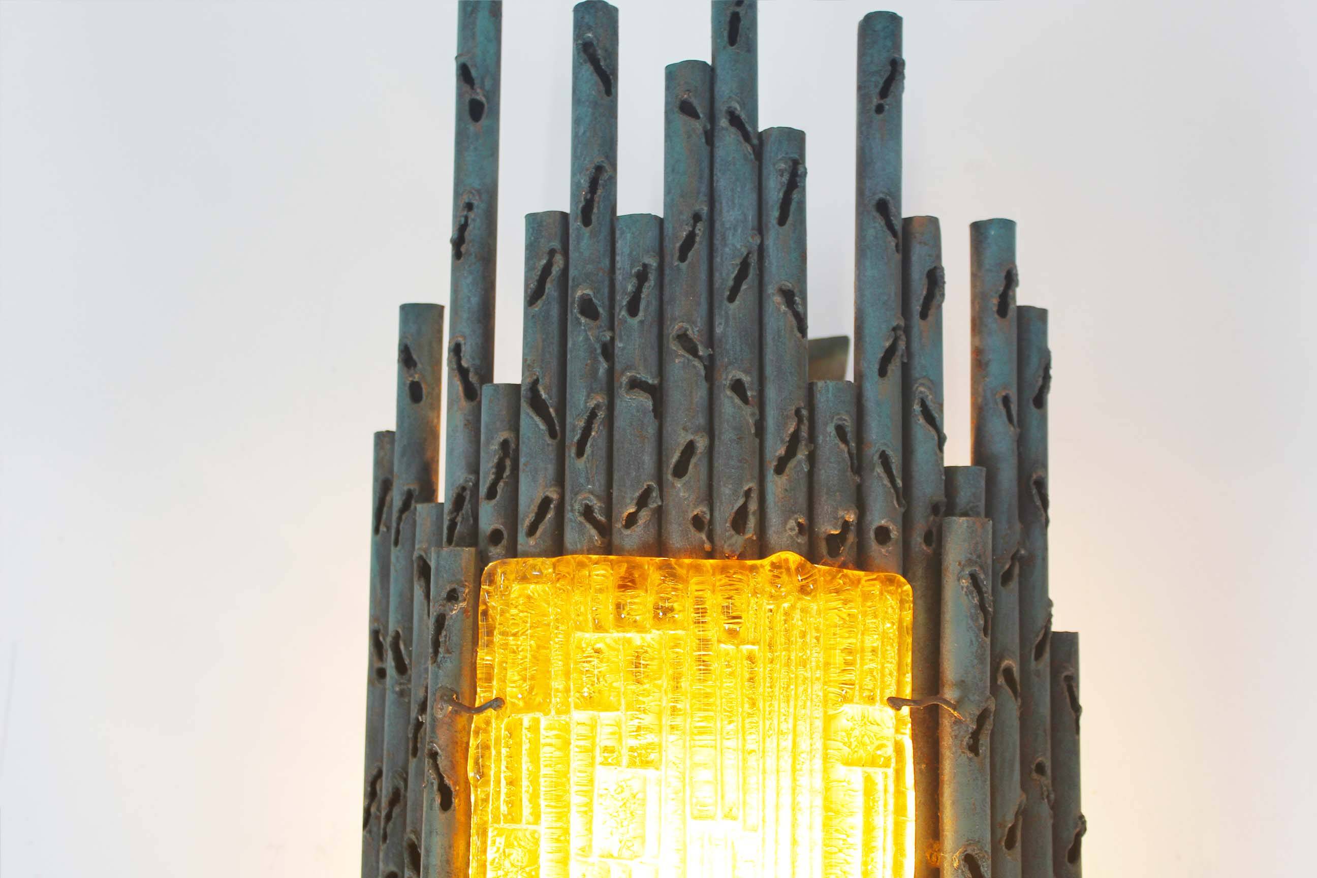 brutalist rough iron and glass wall sconce by Marcello Fantoni