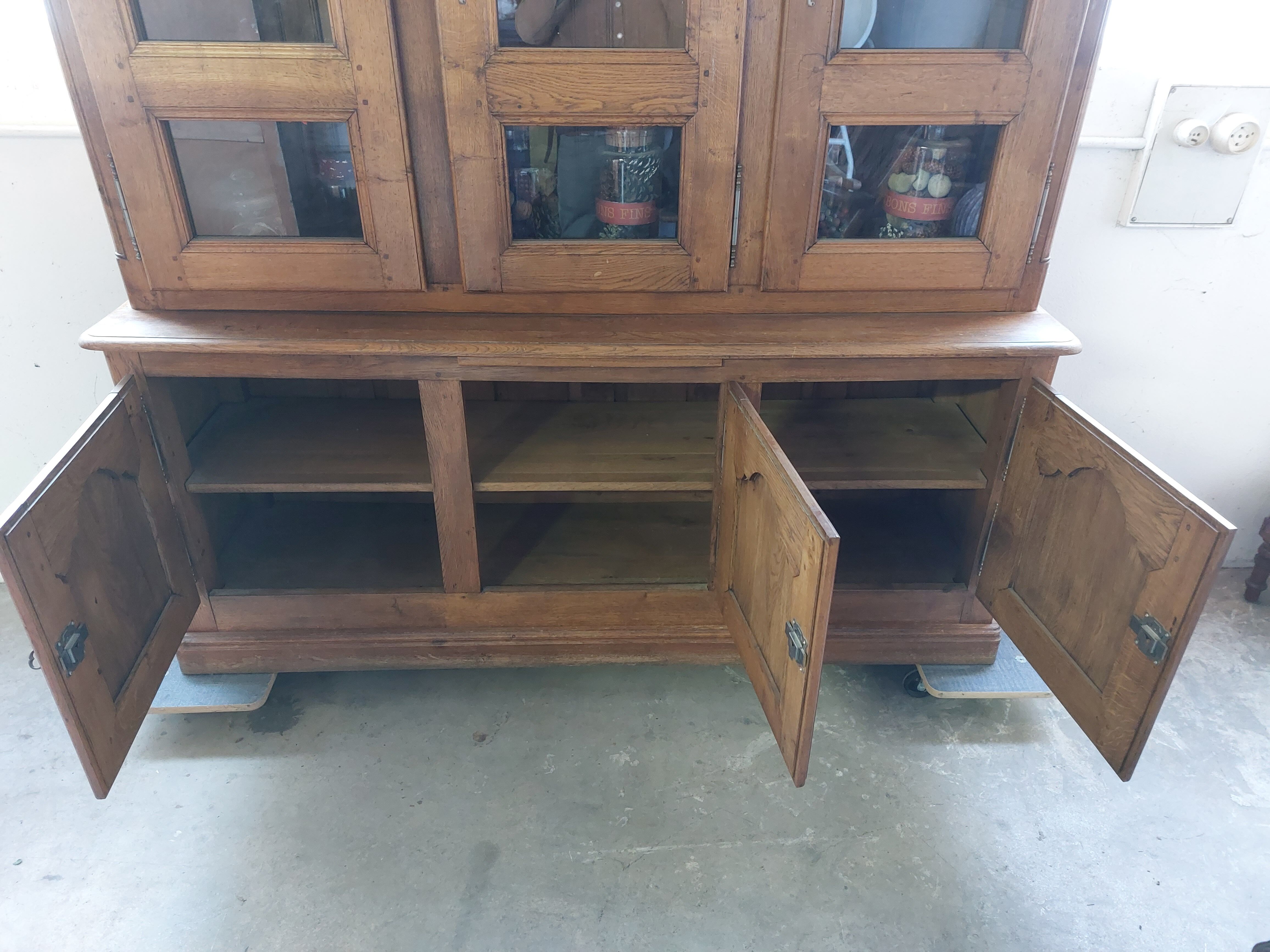 Showcase library with two sections in solid oak.